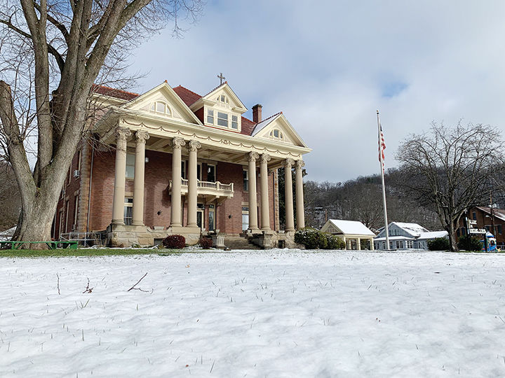 Snowfall blankets area, results in cancellations